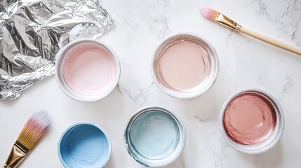 Soft Pastel Paints in Bowls with Brush on Marble Background