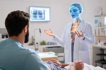 Holographic female doctor consulting patient in hospital room