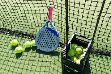 Paddle racket with a ball ready to play the fastest growing sport in recent years worldwide. Padel...