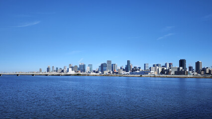 Yodo River at Osaka Umeda modern buildings japanese city skyline with clear blue sky