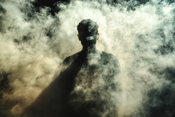 Silhouetted male in smoke cloud - mysterious atmosphere with dramatic lighting