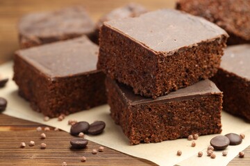 Delicious chocolate puffed rice bars on wooden table, closeup