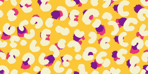 Modern seamless animal-inspired pattern with bold colorful spots on a soft vibrant yellow background. Vector leopard print. Trendy, vibrant design ideal for fashion, textiles, stationery