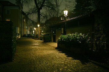 Atmospheric, Dark, empty and eerie urban city alley at night. Warsaw Oldtown at night