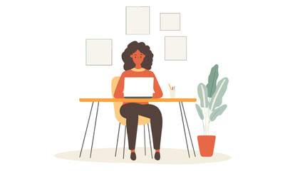 Woman is sitting at a desk with a laptop