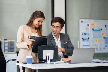 Fototapeta premium Happy smiling businessman feel happy work complete Teamwork success, success at work in the office concept.