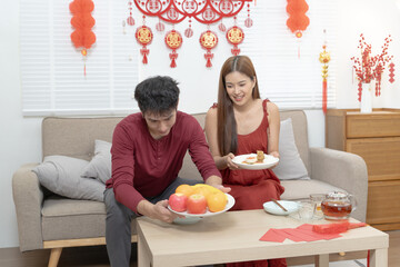 Asian family preparation red lanterns in their house and celebrating chinese new year