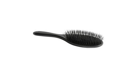 A simple black hairbrush lying on a white surface with a transparent backdrop, ready for daily grooming activities.