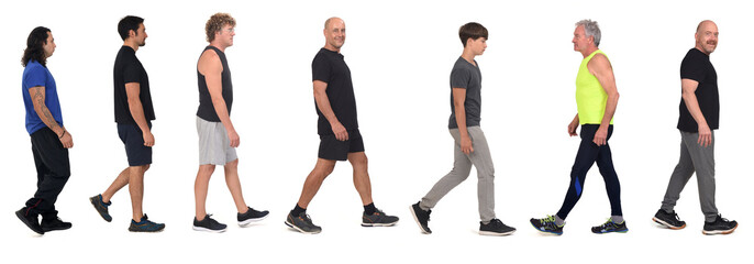 side view of a group of men dressed in sportswear on white background