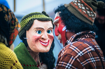 Ancient carnival with wooden masks from Sauris. Magic of Carnia for the arrival of spring.