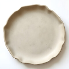 A minimalist earthenware plate with a matte finish and uneven edges, on a white background