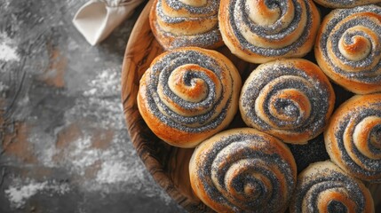 Fototapeta premium Delicious fresh poppy seed buns arranged in a rustic basket showcasing their spiral design and golden-brown crust.