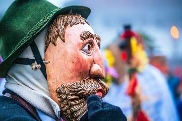 Ancient carnival with wooden masks from Sauris. Magic of Carnia for the arrival of spring.