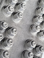 large bolts and nuts on a metal structure