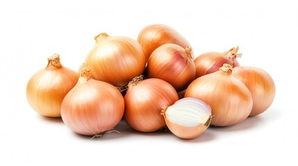 fresh brown onions grouped with one cut in half on white background