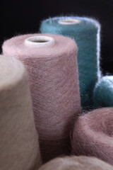 Fluffy yarn for knitting. Multicolored wool yarn in bobbins. Yarn for knitting handmade winter clothes. Lot of tangles.