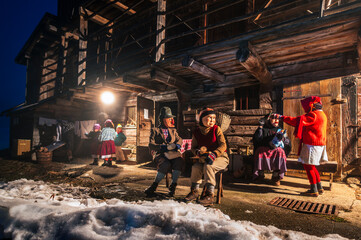 Ancient carnival with wooden masks from Sauris. Magic of Carnia for the arrival of spring.