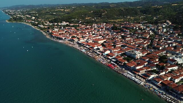 Drone footage panorama of Pefkochori beautiful tourist city by the sea on Kassandra peninsula, Halkidiki, Greece