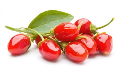 Fresh goji berries with green leaves arranged on a white background showcasing their vibrant color and natural beauty in a healthy lifestyle concept