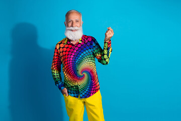 Photo of stylish charismatic aged man show korean heart symbol empty space wear shirt isolated on blue color background