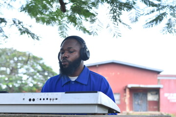 handsome Man plays the piano outdoor