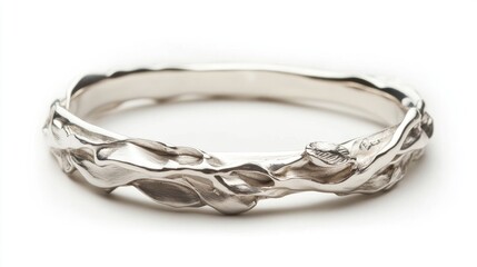 Intricately designed handmade silver bangle showcasing unique craftsmanship on a clean white background