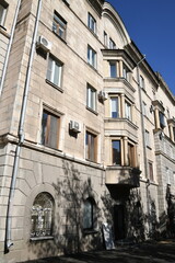 Architecture of old Soviet Union houses in Stalin's Empire style. Exterior of the facade of a vintage residential building in Russia