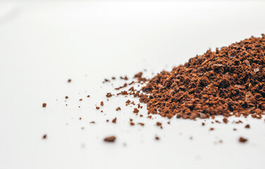 Ground coffee powder or fresh coffee grain isolated on white background