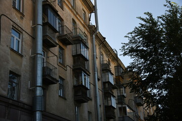 Architecture of old Soviet Union houses in Stalin's Empire style. Exterior of the facade of a vintage residential building in Russia