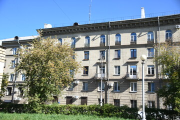 Architecture of old Soviet Union houses in Stalin's Empire style. Exterior of the facade of a vintage residential building in Russia