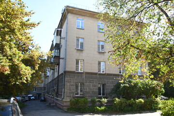 Architecture of old Soviet Union houses in Stalin's Empire style. Exterior of the facade of a vintage residential building in Russia