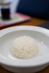 A white bowl of tasty cooked white rice