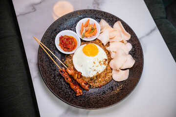 Fried rice with egg and chicken satay