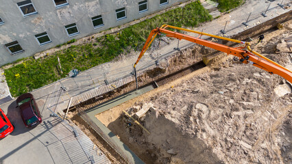 Aerial View of Construction Site with Concrete Pump