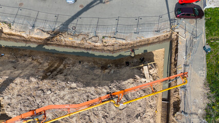 Aerial View of Construction Site with Concrete Pump