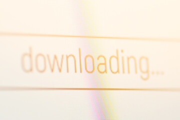 Downloading icon on computer screen. Concept of downloading files from the Internet to personal computer