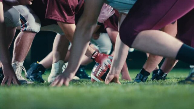 American Football Championship Start Teams Ready: Professional Players, Aggressive Face-off, Start Pushing, Tackling. Competition Full of Brutal Energy, Skill. Cinematic Slow Motion. Dramatic Sport