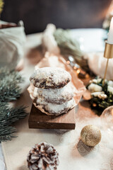 Christmas stollen cookies on the festive table, Scandinavian style, Scandinavian Christmas, candles, Christmas tree