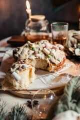 Cinnabon with marshmallows, buttercream and nuts on a festive table, Scandinavian style, Scandinavian Christmas