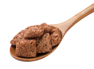 Corn pads in a wooden spoon close-up on a white. Isolated