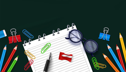 Spiral Notebook with Stationery Items on Dark Background