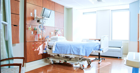 Private Room In Modern Hospital With Empty Bed And Medical Tech Equipment