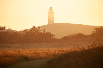 Lighthouse of Rubjerg Knude at sunset. Denmark north sand hills.