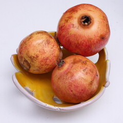 pomegranate on a bowl