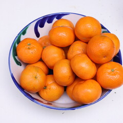 tangerines in a bowl top view
