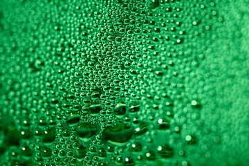 Close Up of Condensation Floating Liquid Water Bubbles and Drips on Glass from Rain