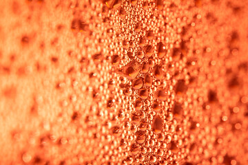 Close Up of Condensation Floating Liquid Water Bubbles and Drips on Glass from Rain