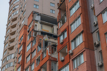 Russian missile hits residential building in Dnipro, Ukraine. Aftermath of enemy attack on city. Destroyed residential multi-story building. Close-up. War. Aftermath of explosion.