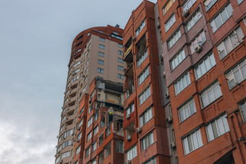 Russian missile hits residential building in Dnipro, Ukraine. Aftermath of enemy attack on city. Destroyed residential multi-story building. Close-up. War. Aftermath of explosion.