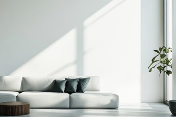 Modern minimalist living room with a light grey sofa, dark green pillows, and a wooden coffee table. Sunlit.